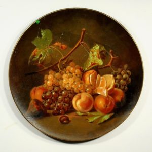 Large terracotta wall plate with fruits