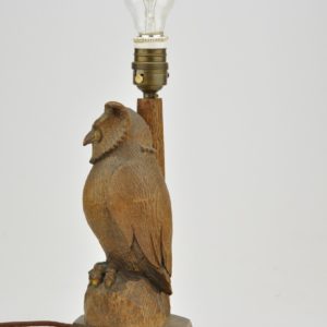 Old wooden desk lamp with owl