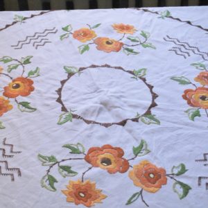 An old fashioned embroidered round tablecloth
