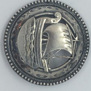 Metal Viking ship brooch