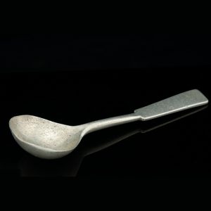 Antique aluminum spoon