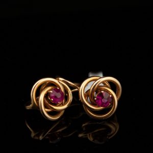 Gold earrings with red stone