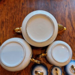 Antique porcelain teapot, sugar toast, cream bar