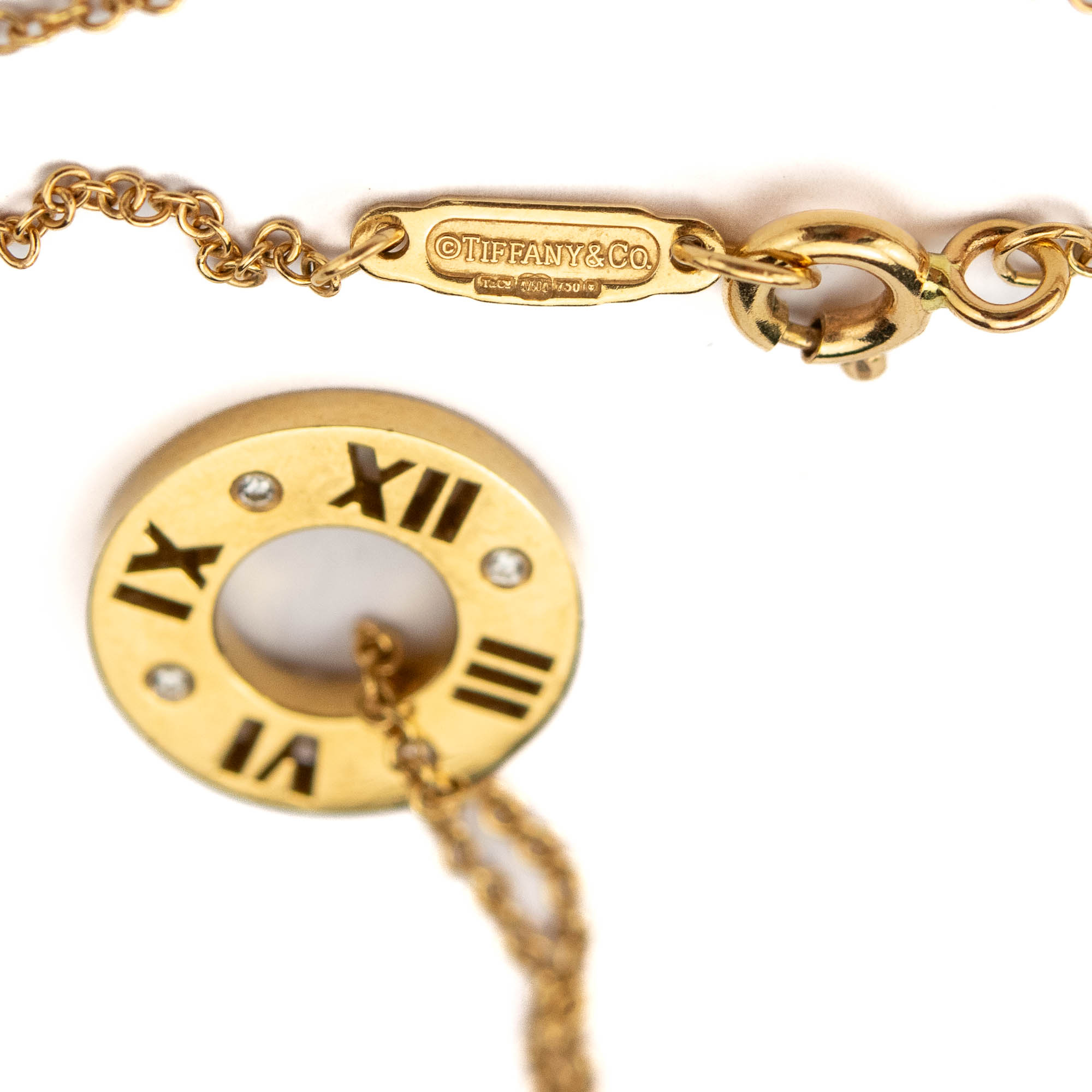 Tiffany & Co kuldkett ripatsiga,750 kuld 4 briljandiga Tiffany & Co kuldkett ripatsiga,750 kuld 4 briljandiga