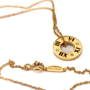 Tiffany & Co kuldkett ripatsiga,750 kuld 4 briljandiga Tiffany & Co kuldkett ripatsiga,750 kuld 4 briljandiga
